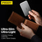 Pisen ultra-slim power bank held above brown wallet, highlighting wireless and USB-C charging.